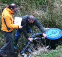 Allender shows microhydro setup to BBC's Roger Harrabin